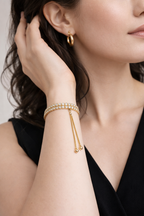 Double Row Diamond-Studded Gold Bracelet with Tassel Chain