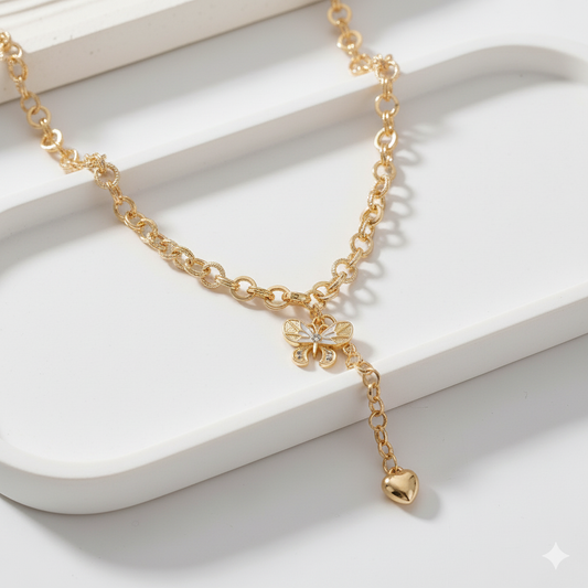 Golden Butterfly Charm Necklace with Heart Drop – Symbol of Grace & Freedom